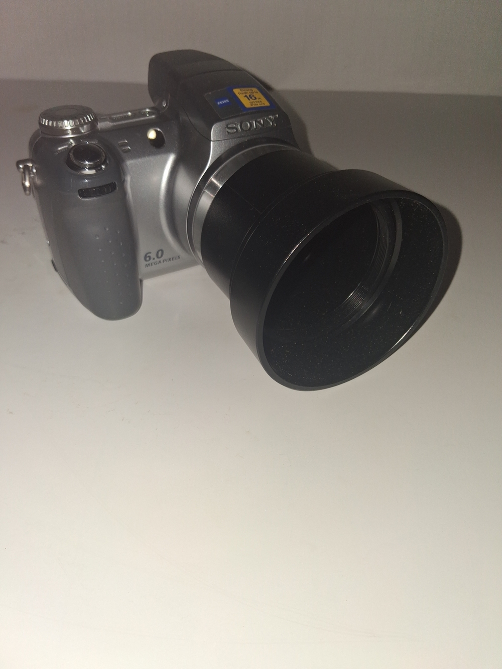 Sony Silver Digital Camera with Black Telephoto Lens
